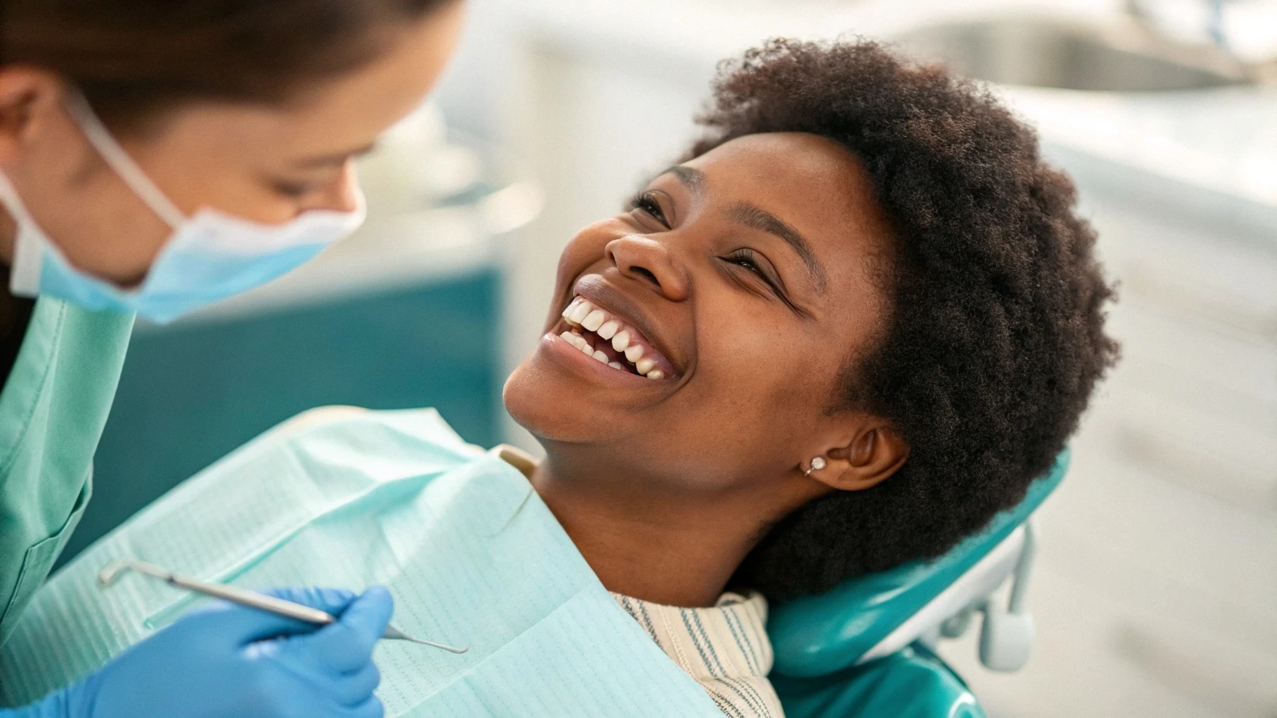 Dental professional providing calm, reassuring care to a patient during a dental procedure with sedation and monitoring
